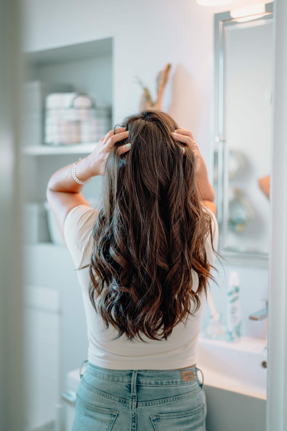 Batiste applied to curly hair demonstrating refreshed, defined curls benefit