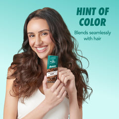 Batiste applied at dark hair roots reducing shine and restoring volume