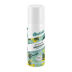 Batiste original next to a hand for scale illustrating travel-friendly size benefit
