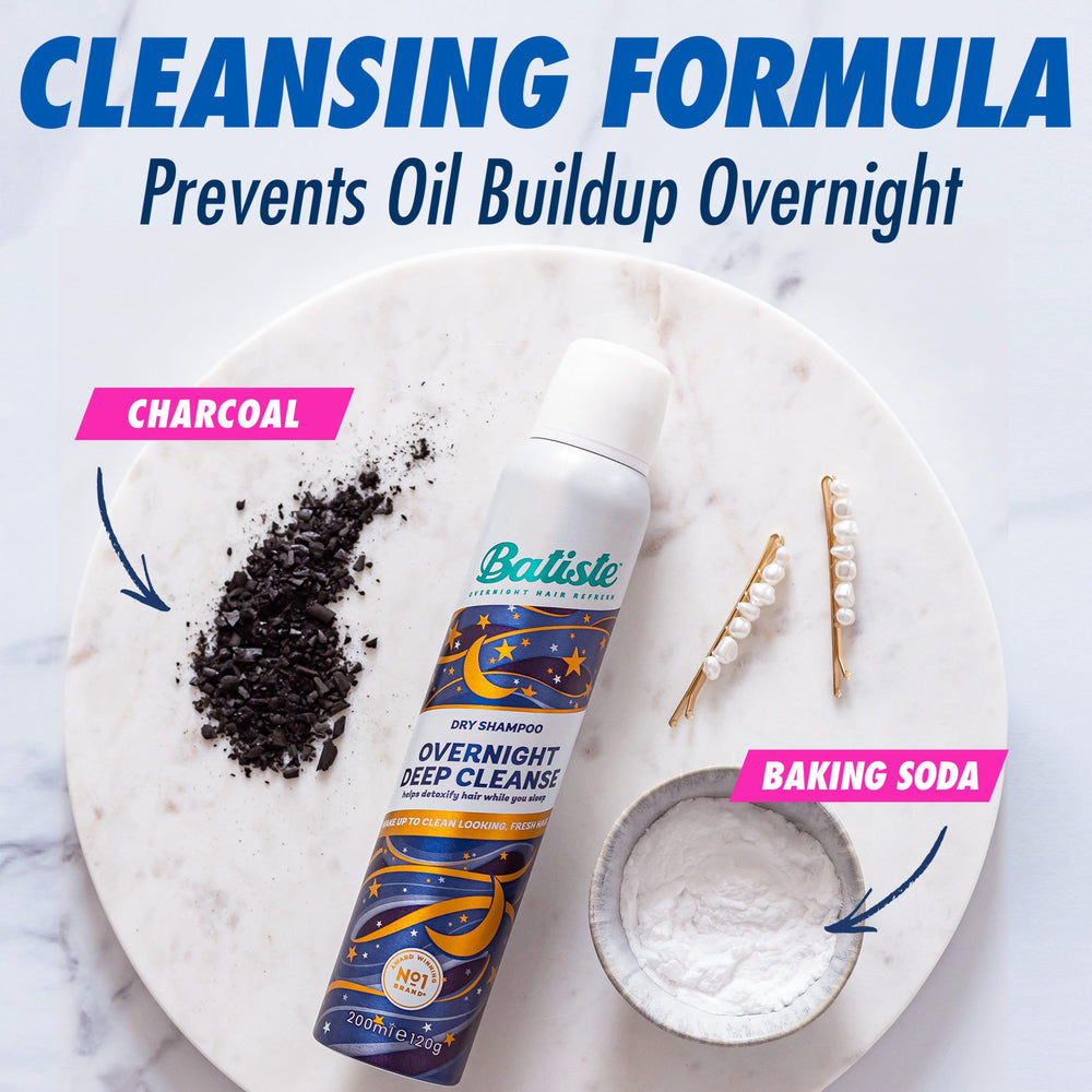 Batiste can spraying into hand to show mist and convenient application