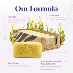 Baudelaire soap in hand for scale showing the 5 oz size and durable bar