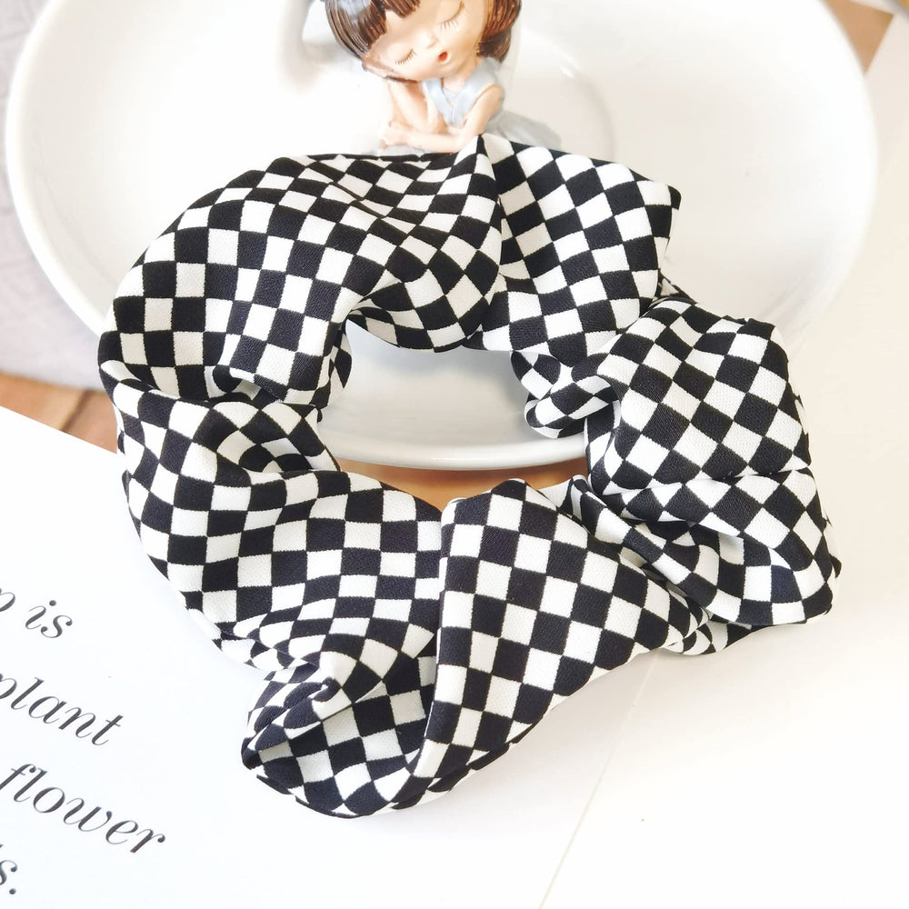 BBTDIN lifestyle flatlay pairing scrunchies with outfit, versatile styling option