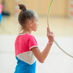 BBTO hair tie holding a gymnast ponytail securely during practice benefit