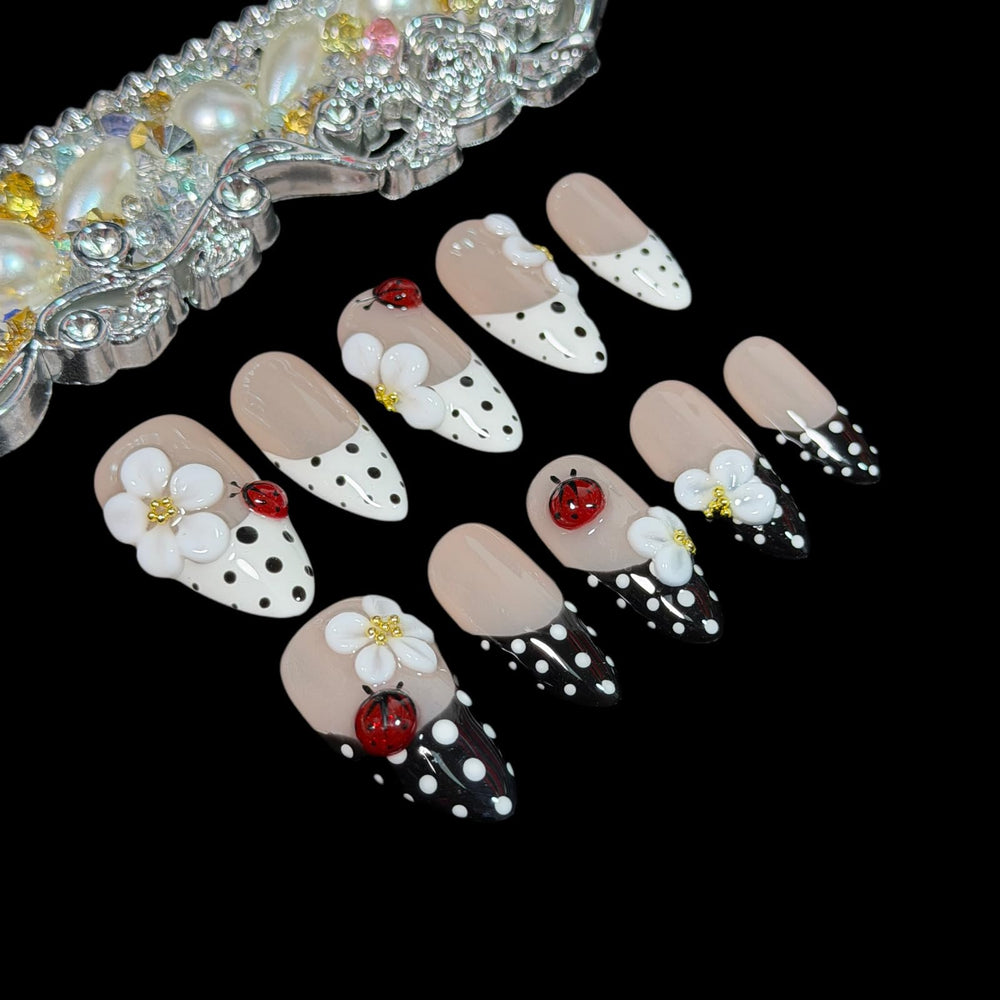 BByogooz tiny red ladybug embellishment on nail, adding playful charm