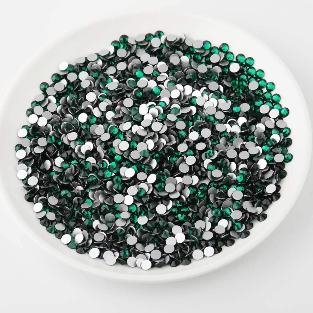BEADSLAND rhinestone applied on a nail design giving jewel-tone focal sparkle
