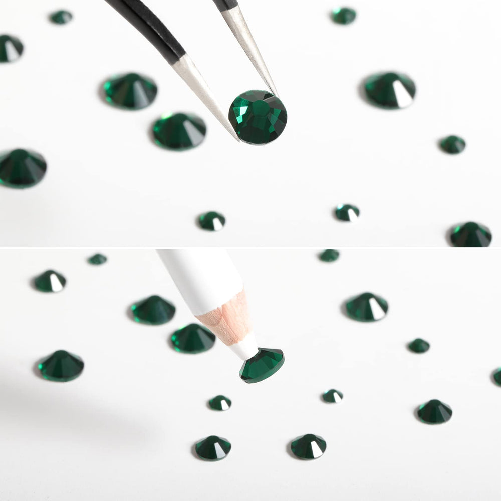 BEADSLAND rhinestones applied on a manicure adding bold emerald accents