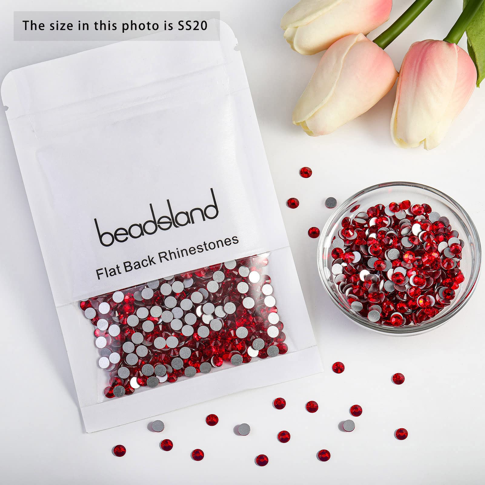 BEADSLAND rhinestones applied to nails highlighting bold color and long-lasting manicure benefit