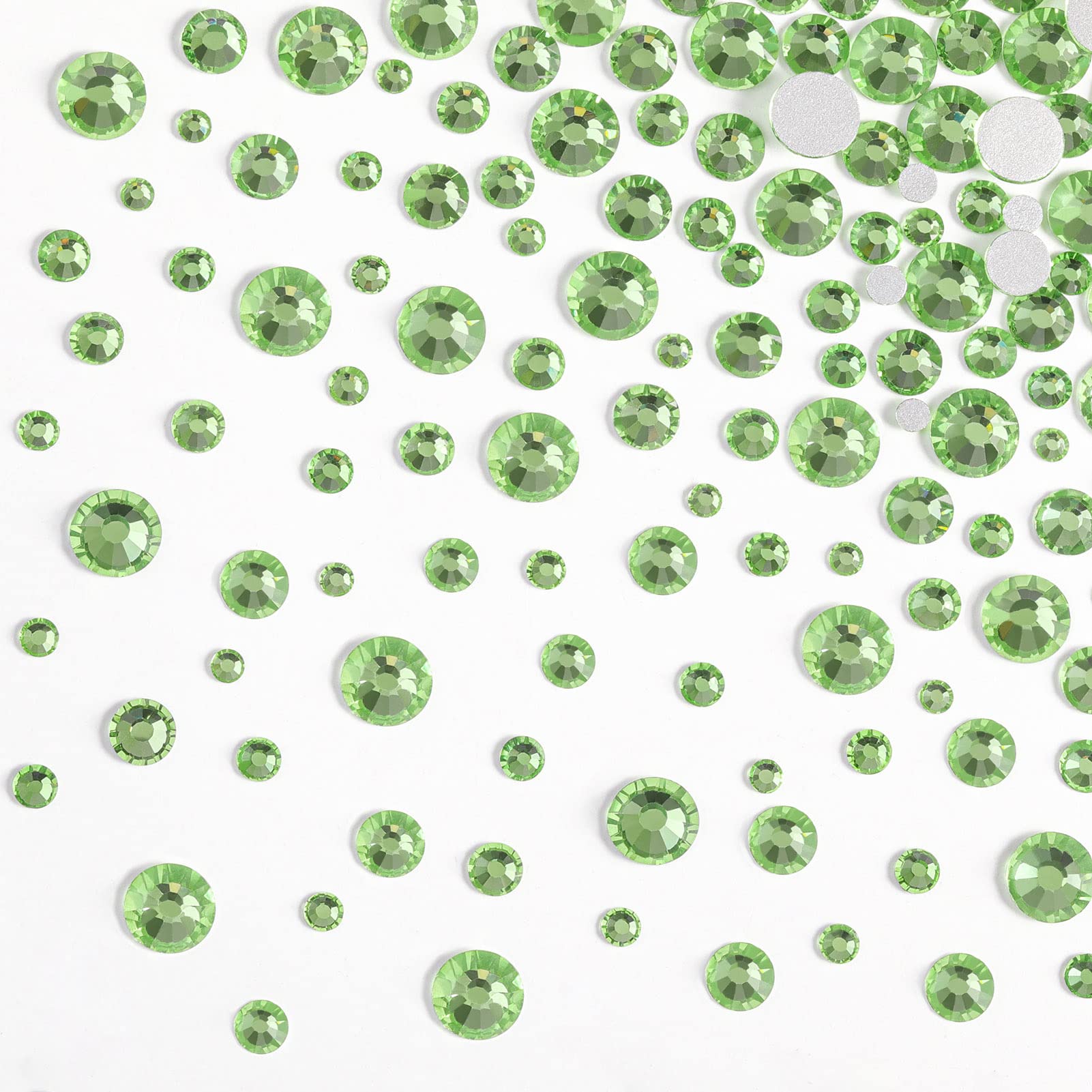 BEADSLAND manicure with peridot gems demonstrating decorative sparkle