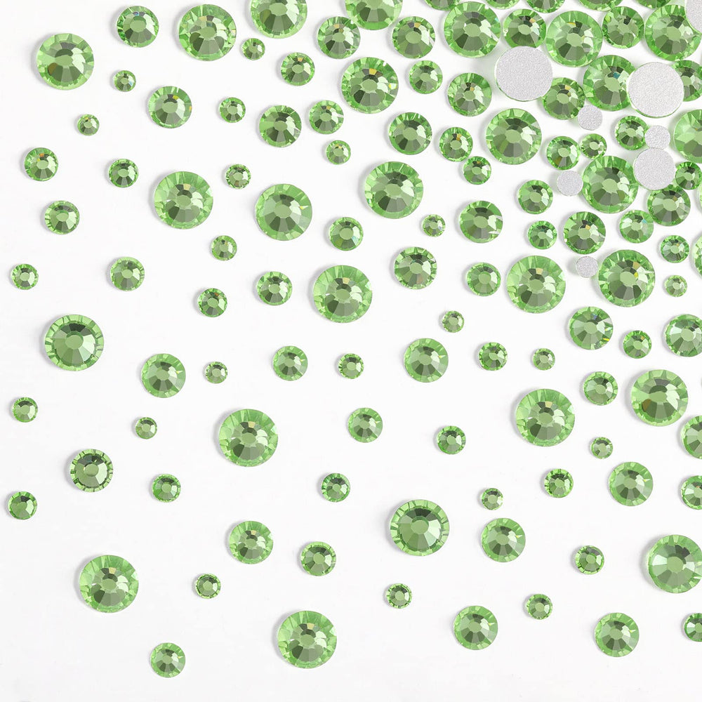 BEADSLAND manicure with peridot gems demonstrating decorative sparkle