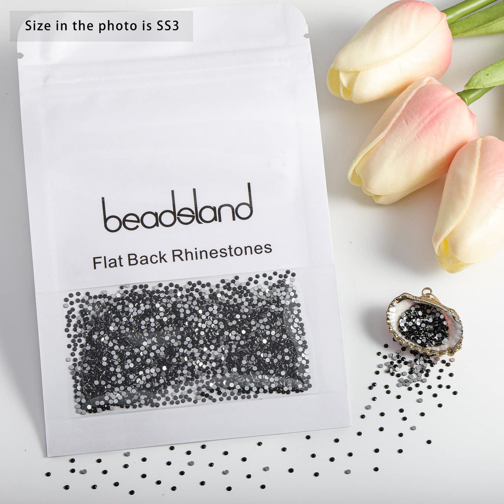 BEADSLAND rhinestones beside a coin to show scale and ease-of-use for micro decorations