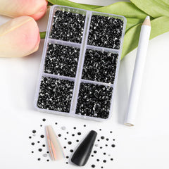 BEADSLAND close-up of cut glass facets on jet black rhinestone, brilliant sparkle