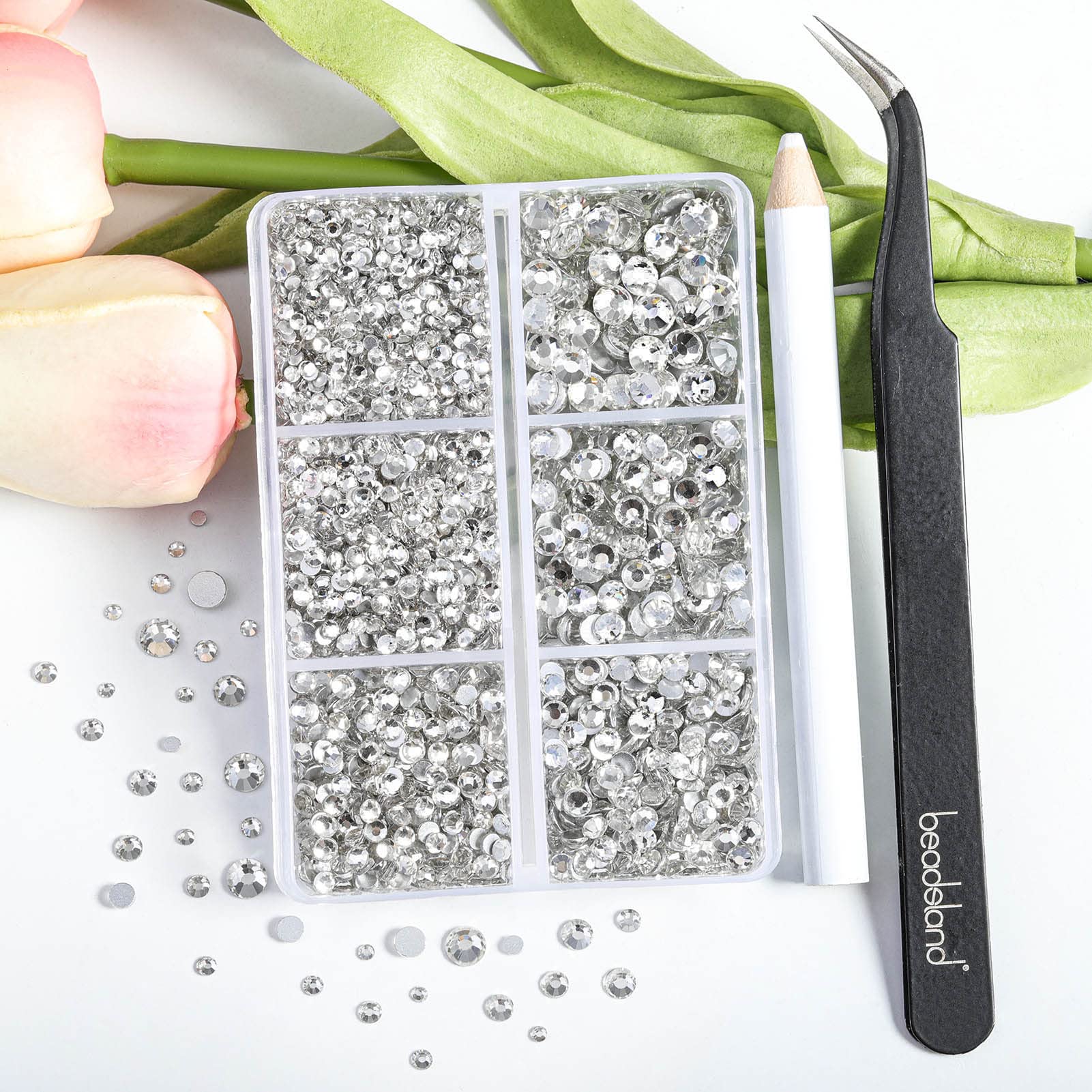 BEADSLAND close-up of mixed sizes SS6 to SS20 revealing precise glass cuts and sparkle