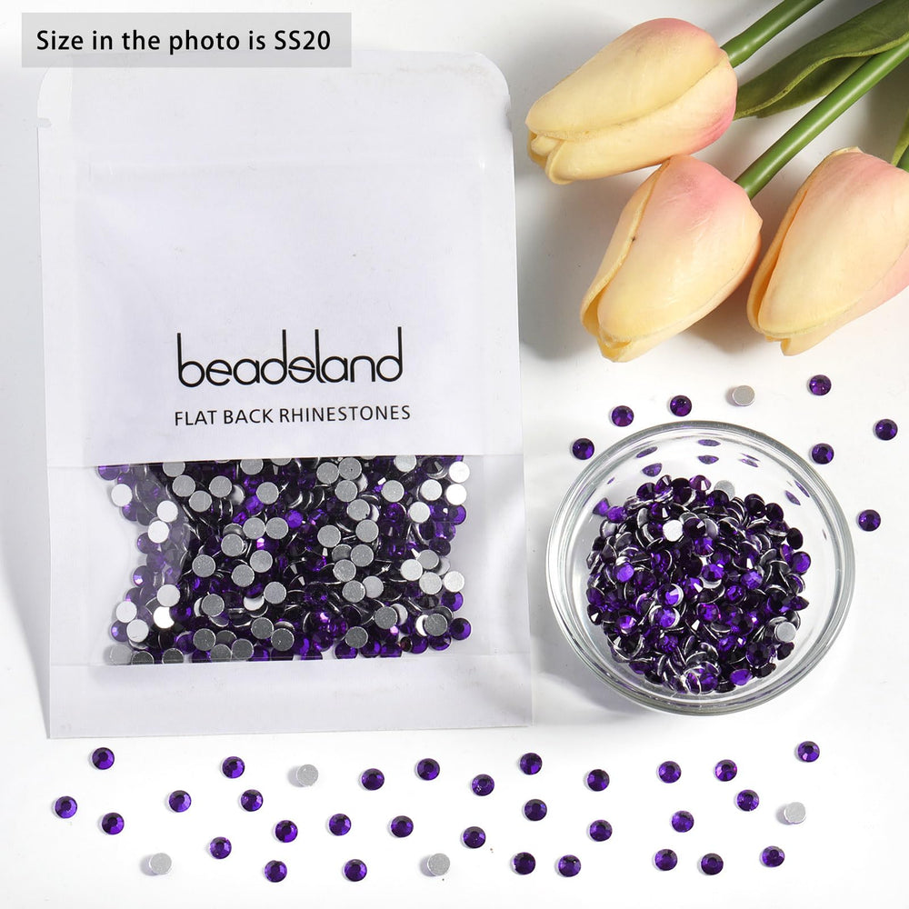 BEADSLAND SS30 rhinestone beside a coin to show size and practical scale