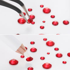 BEADSLAND tweezers and wax pencil positioned with gems for precise placement
