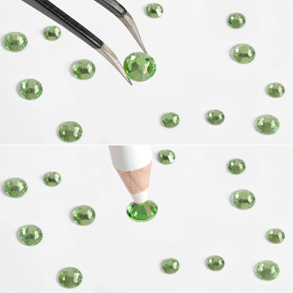 BEADSLAND tweezers and wax pencil next to gems for precise placement