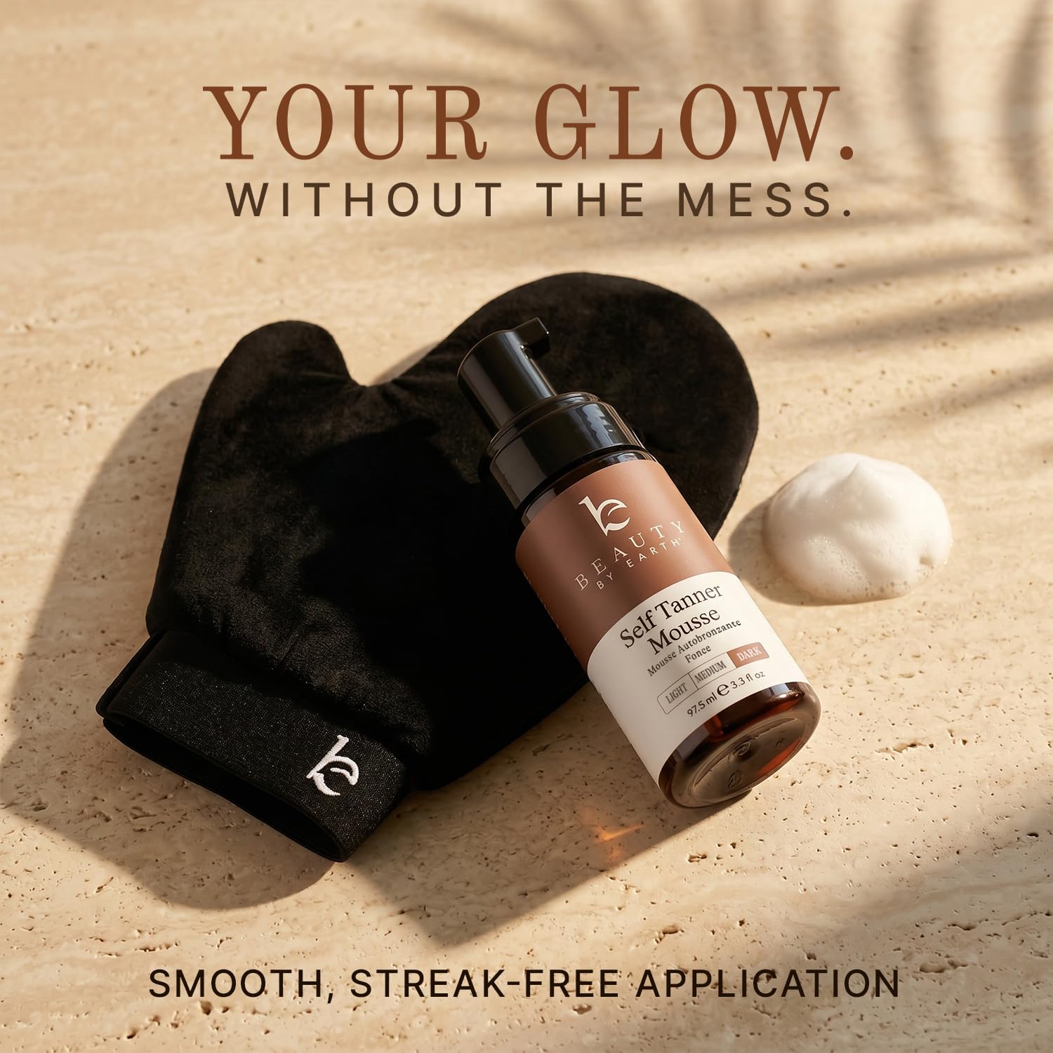 Beauty by Earth applicator mitt in hand for streak-free, even tanning benefit