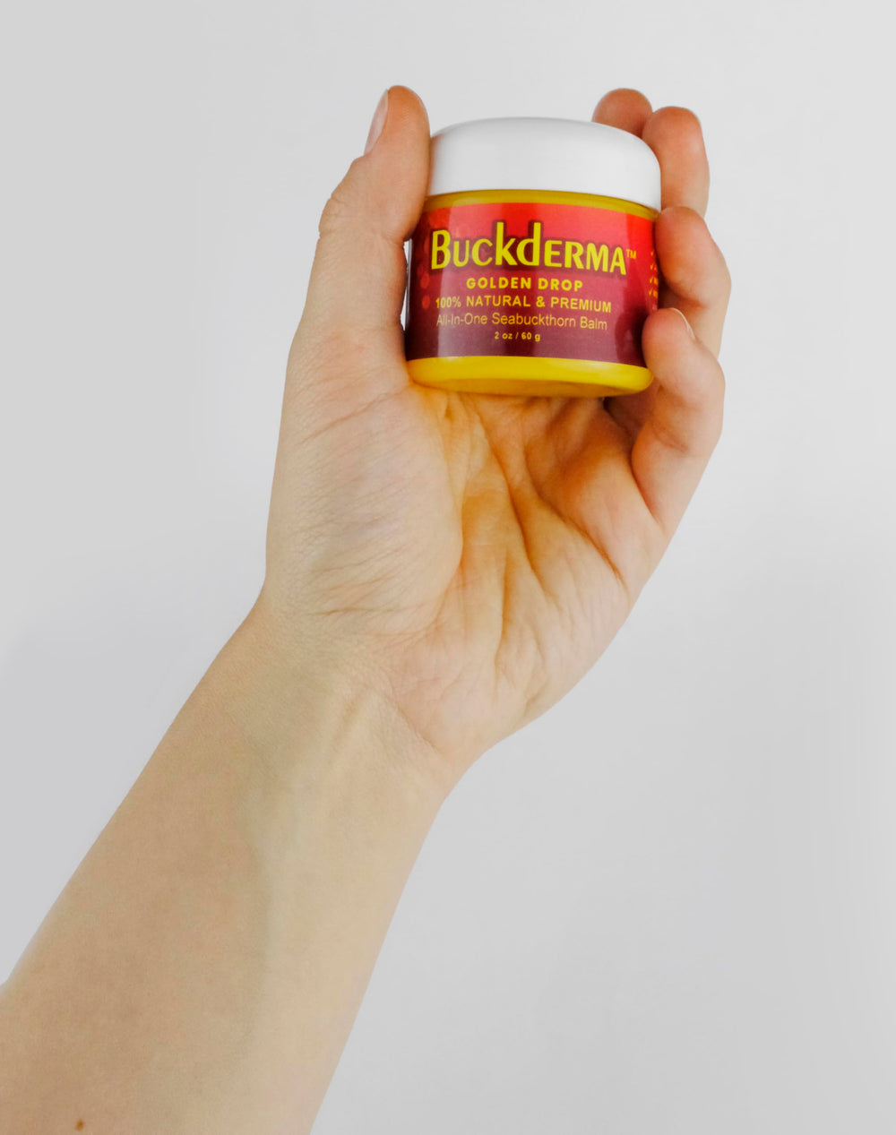 Beesaluxe Buckderma ingredient flatlay with seabuckthorn and oils highlighting natural formulation benefit