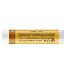 Beessential hand holding single tube illustrating compact travel-friendly size