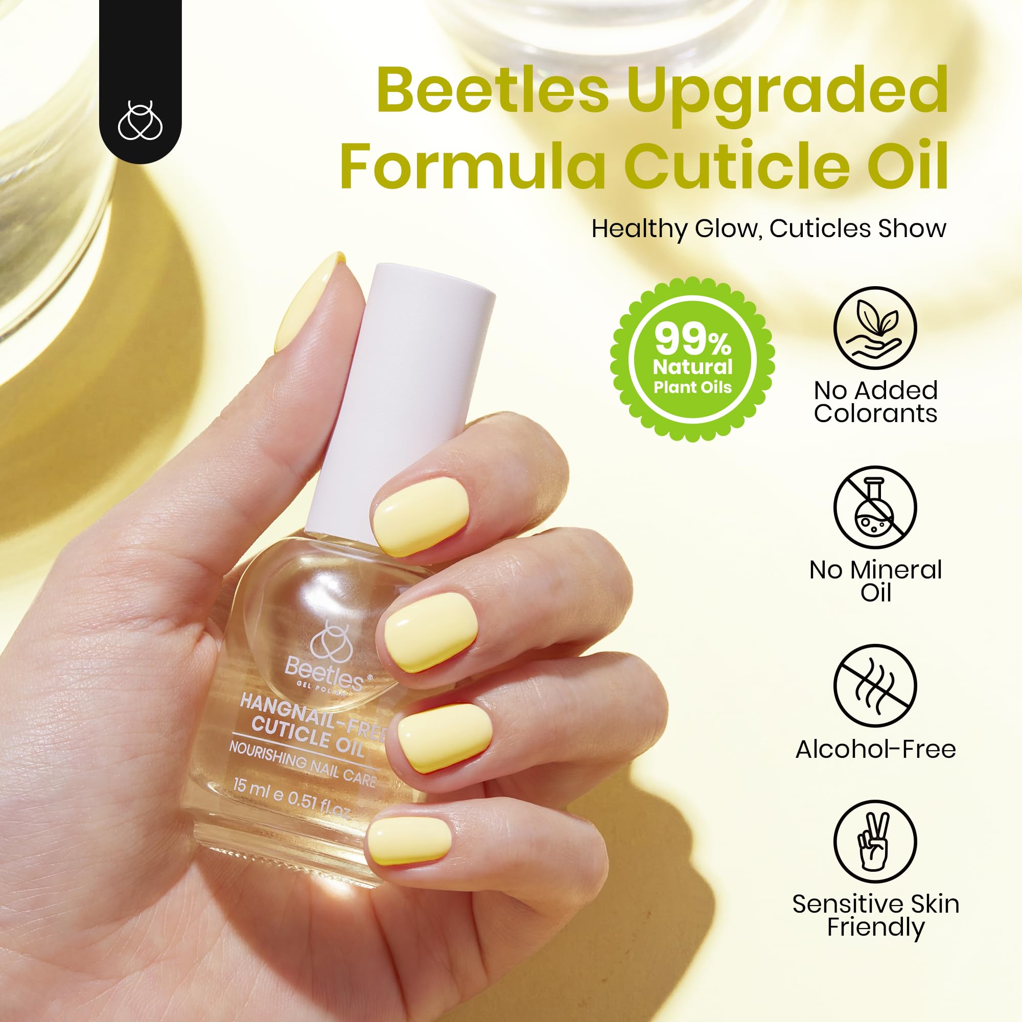 Beetles cuticle oil next to coin for scale showing compact 15ml travel convenience