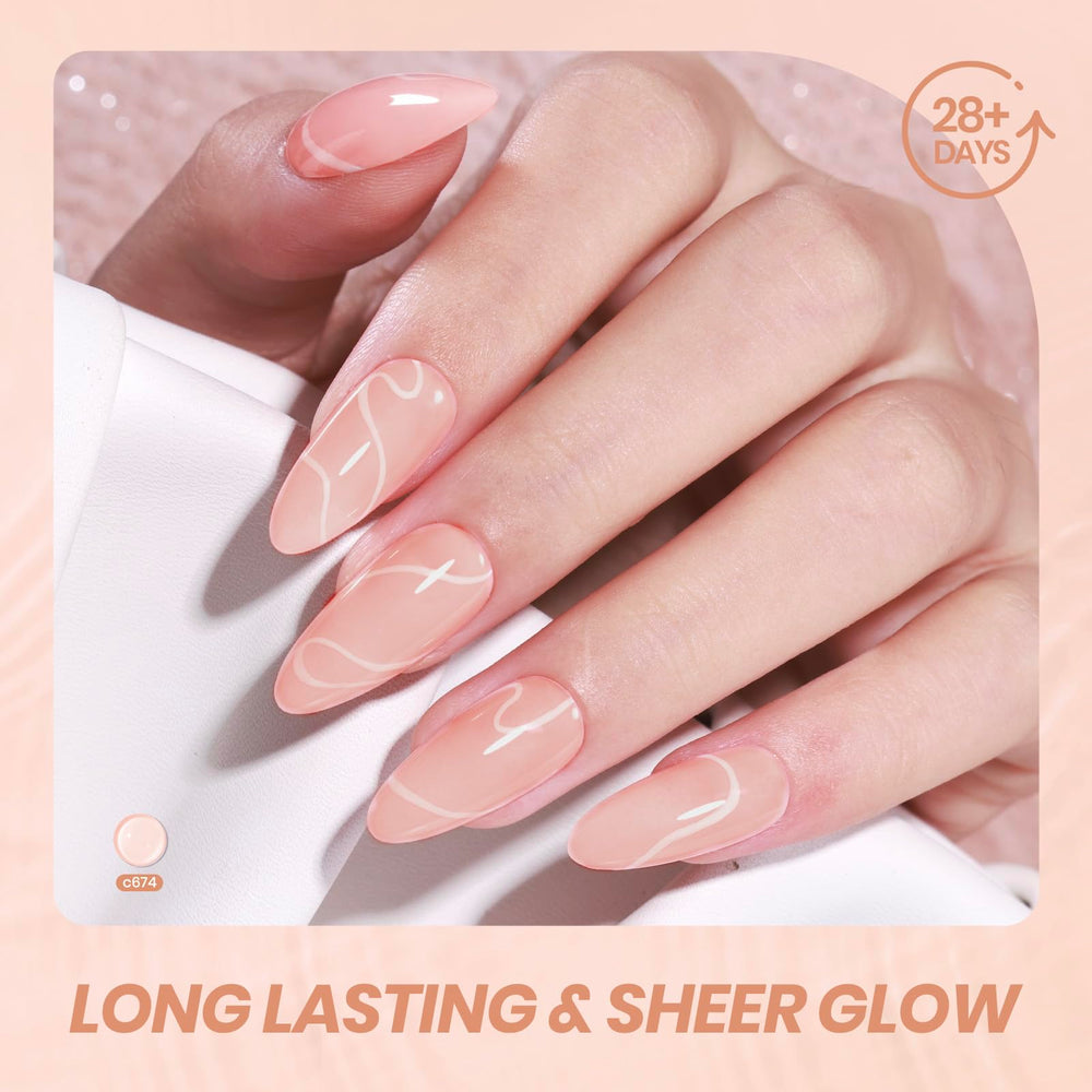 Hands with soft French manicure using Beetles nude gel, showcasing wearable elegance