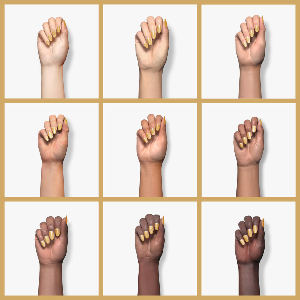 Beetles Gel Polish cured nail swatch displaying high-gloss champagne-gold sparkle