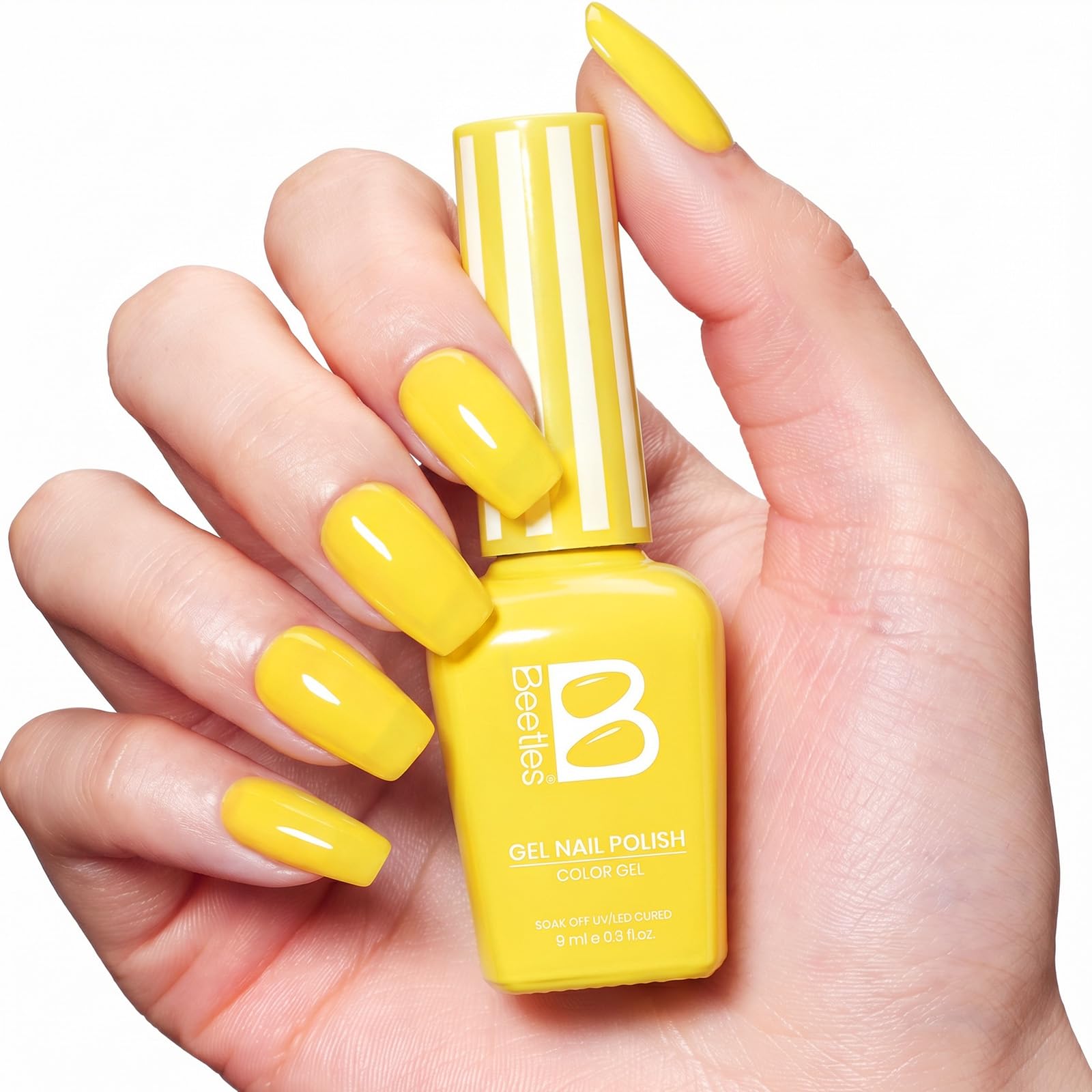 Beach lifestyle shot with Beetles Lemon Stripe nails, bright summer-ready look