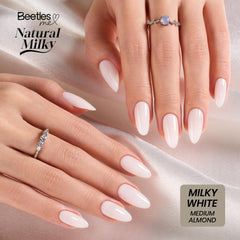 Beetles lifestyle wearing shot showing polished milky white nails ideal for events