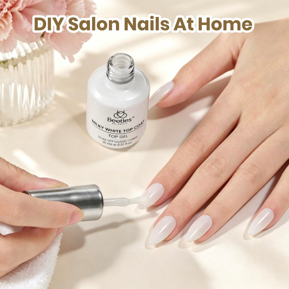 beetles finished manicure lifestyle shot showcasing soft milky aesthetic