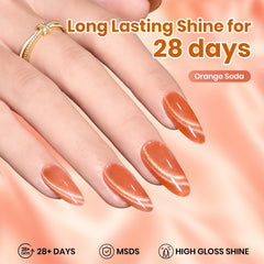 beetles swatch on fingernail displaying vivid orange and golden shimmer