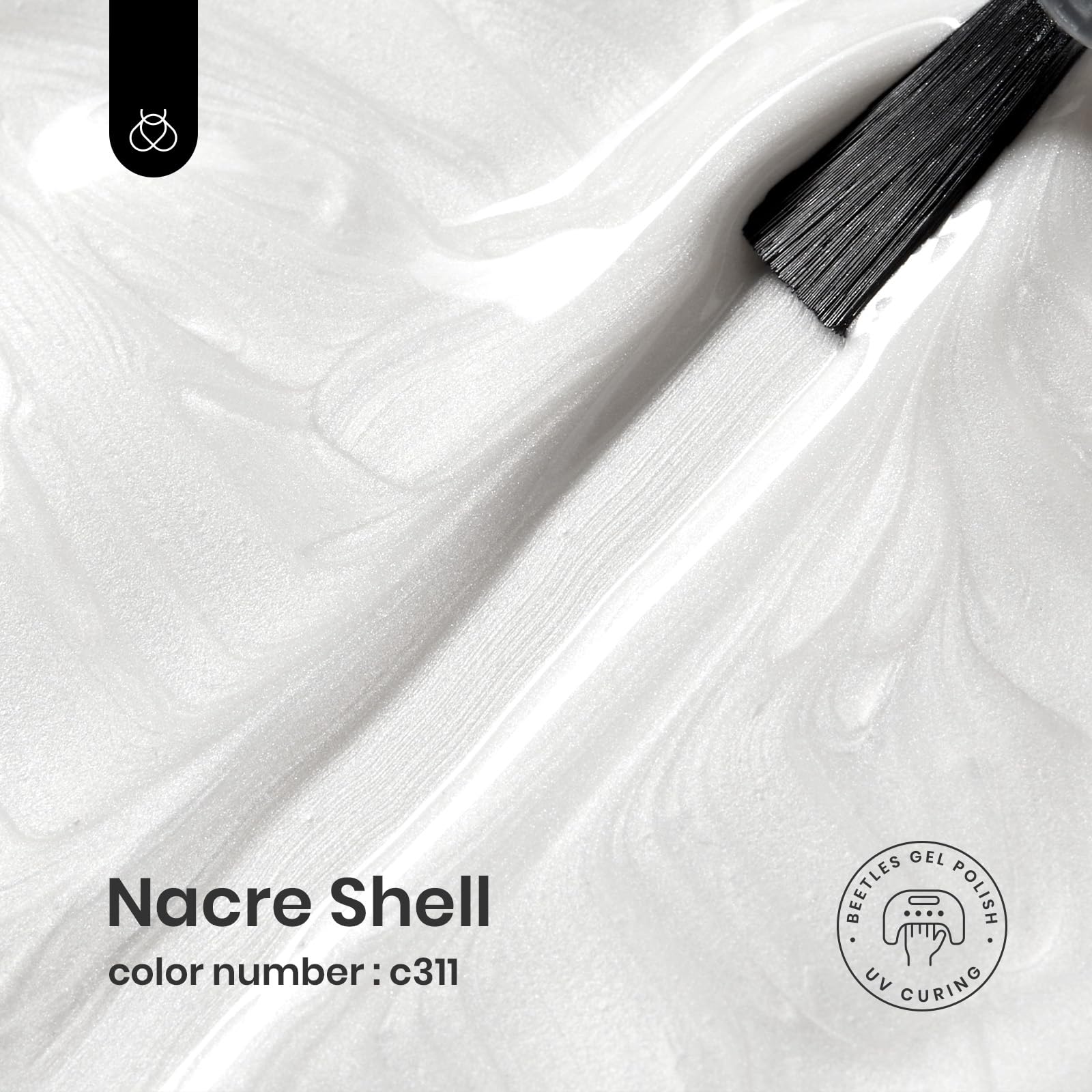 beetles pearl white brush stroke on palette showing smooth coverage and easy application
