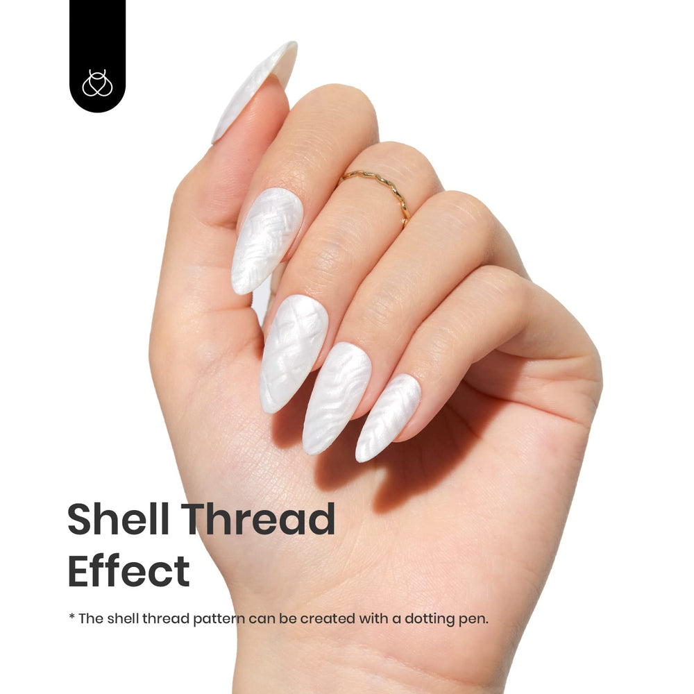 beetles pearl white swatch on nail tips showing pearlescent finish and long-lasting look