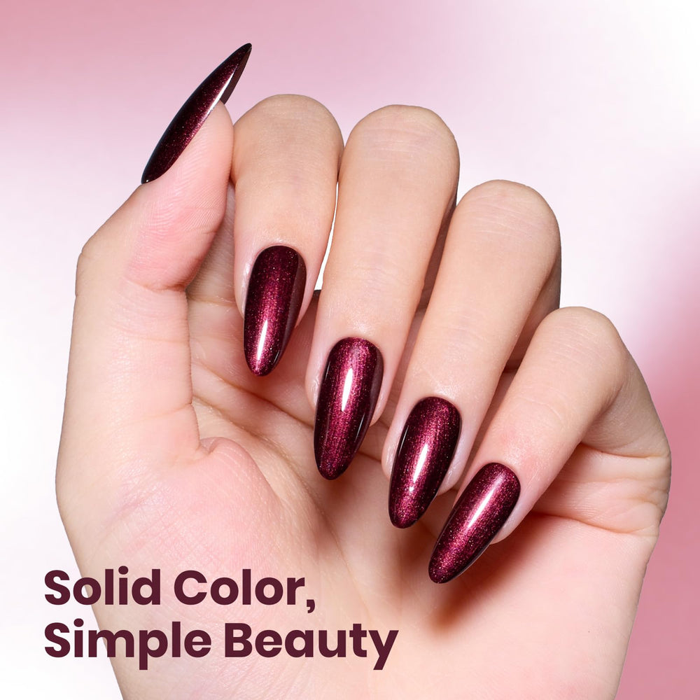beetles swatch painted on fingertips showing burgundy glitter finish and salon shine