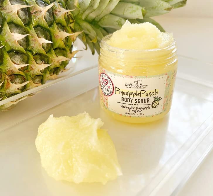 Bella and Bear hand scooping scrub demonstrating easy application and smooth skin