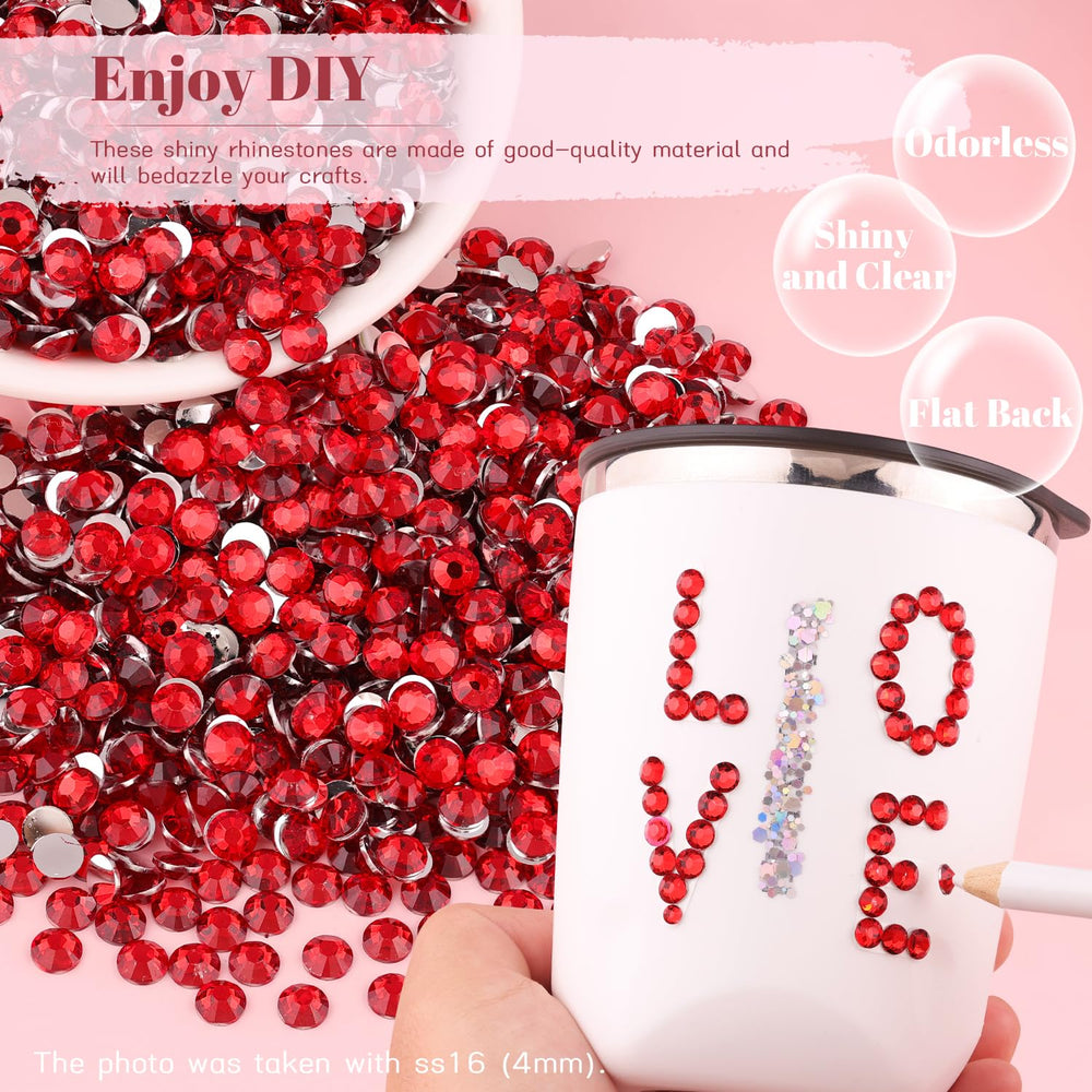 BELLEBOOST red rhinestones applied on a nail design adding detailed sparkle and color