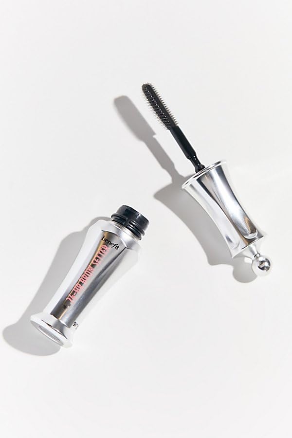 Benefit Brow Setter travel-size next to coin for scale showing compact portability benefit