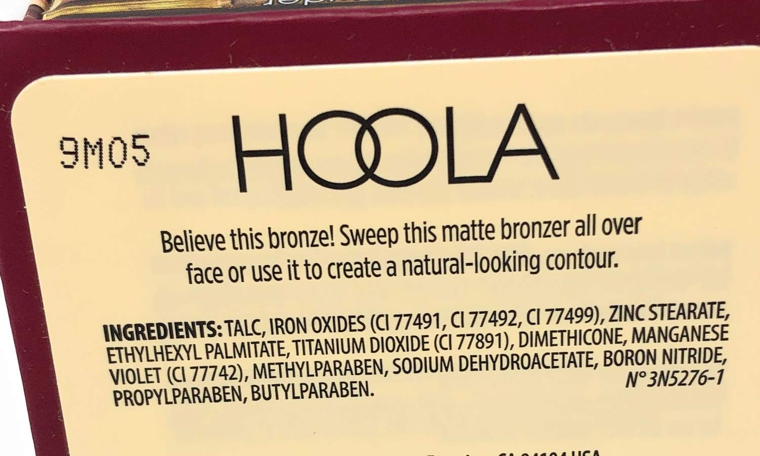 Benefit Hoola scale comparison with coin showing compact .28 oz size and travel convenience