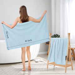 BEoffer towel next to hand showing 41x24 inch size for full coverage