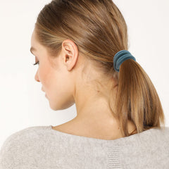 Bessrung hair tie securing a high ponytail demonstrating no-crease removal benefit