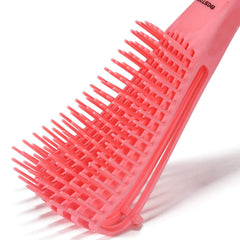 BESTOOL brush next to hand to show scale and easy maneuverability benefit