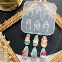 BHCCXZ molds beside a fingernail showing scale and precision fit