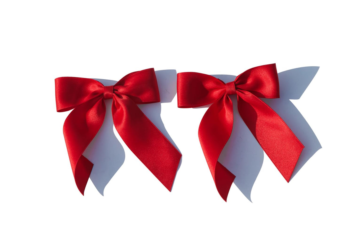BHEXOV red bow front view showing classic shape and vibrant color benefit