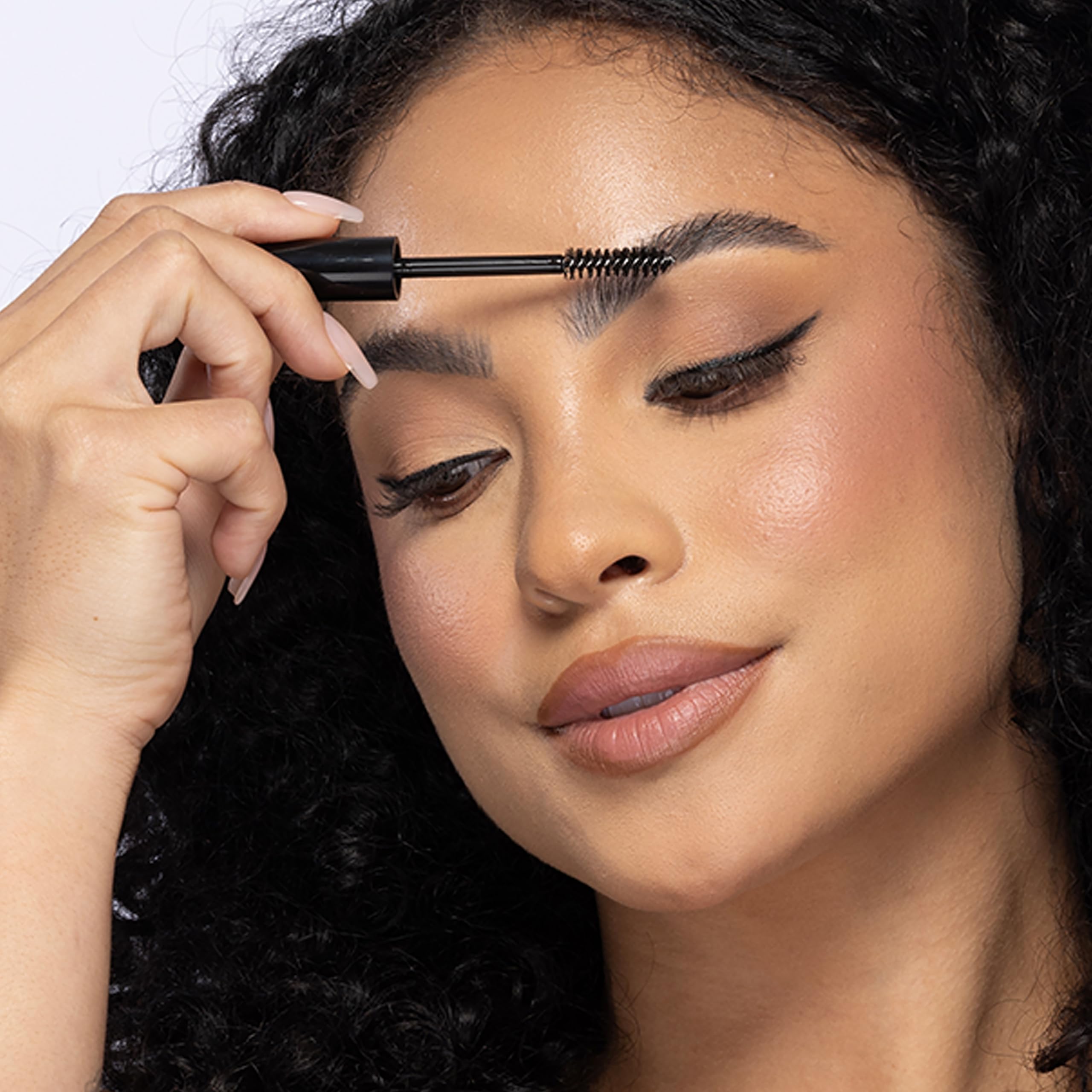 billion dollar brows clear gel applied on brows demonstrating neat, natural hold