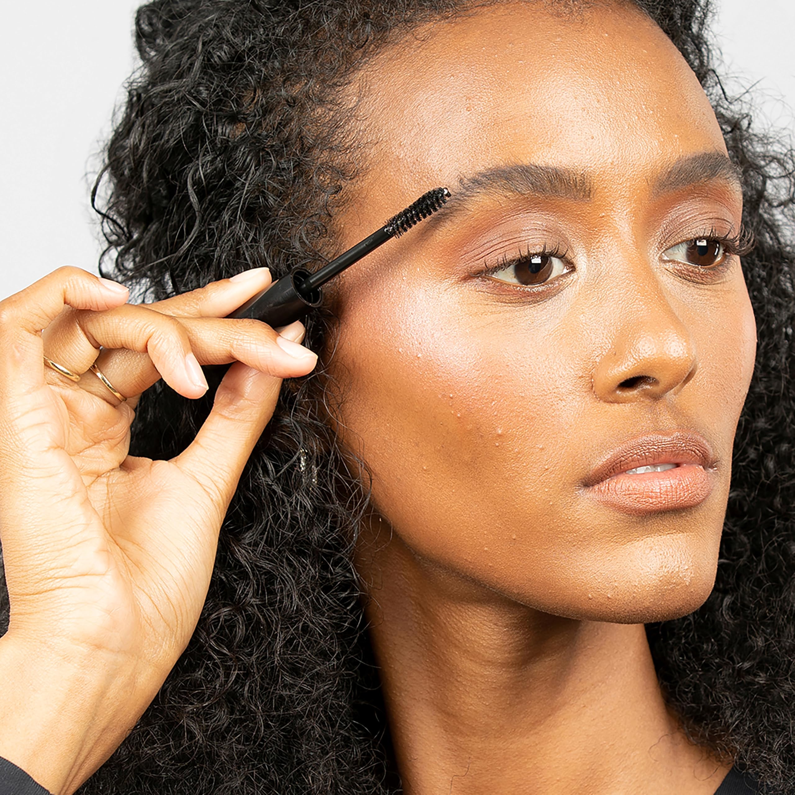 billion dollar brows clear gel next to ruler showing travel-friendly size