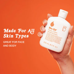 Bio-Oil bottle in hand demonstrating 8.5 oz size for travel and home use