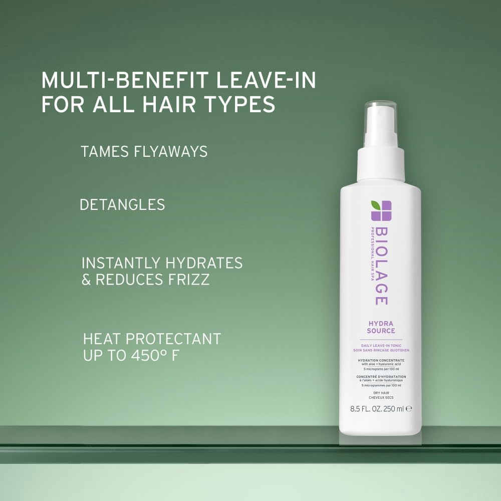 Biolage bottle held in hand to show actual size and travel-friendly convenience