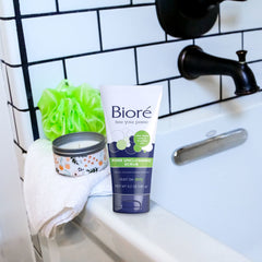 Bioré held in hand to show 5-ounce scale and travel-friendly convenience