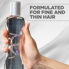 BioSilk texture drop on fingers showing lightweight consistency and shine