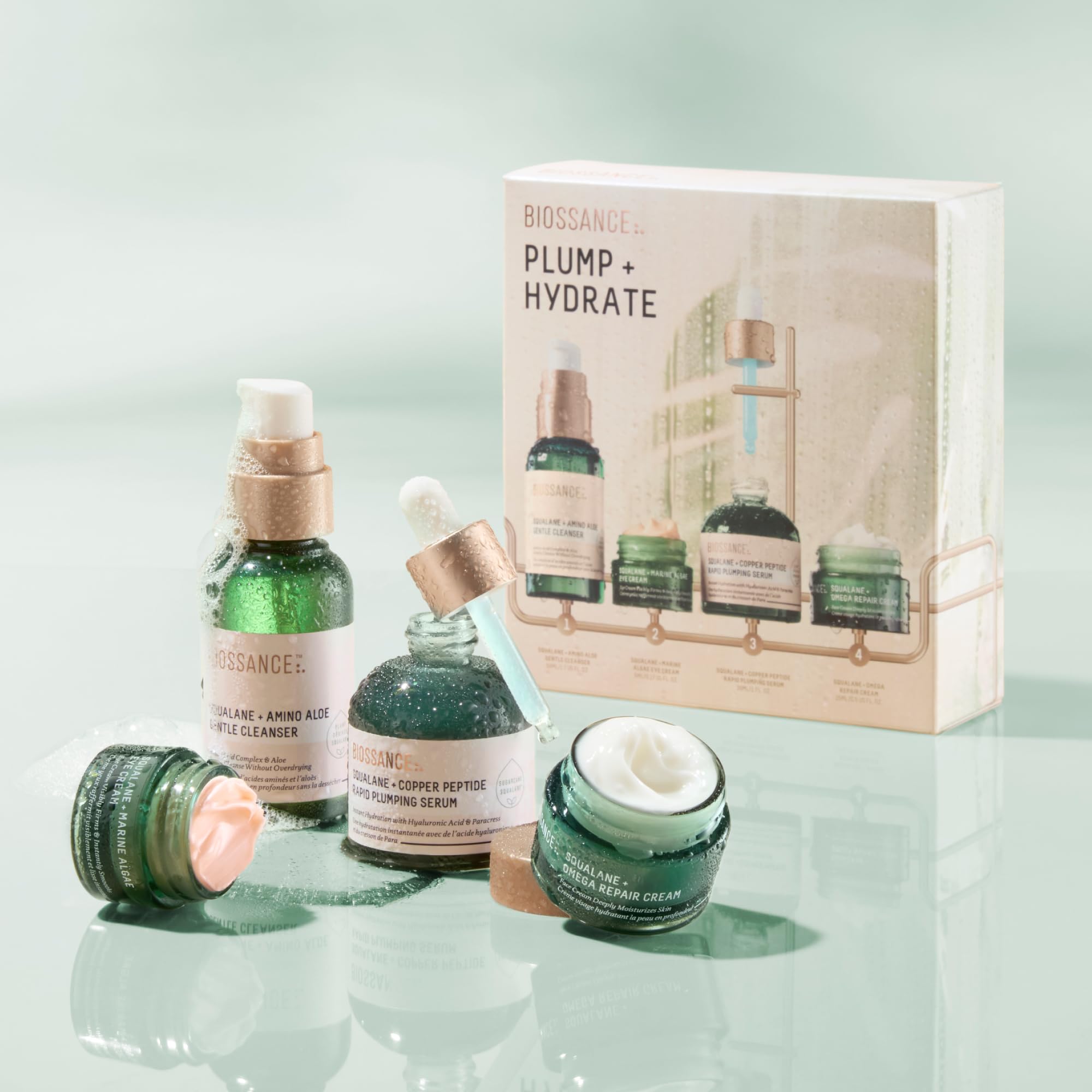 BIOSSANCE tubes and bottles held in hand showing product size and travel ease