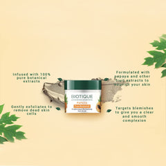 Close-up of scrub grains and papaya pulp, highlights Biotique gentle exfoliation