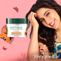 Biotique open jar texture of papaya scrub, shows smooth creamy exfoliant benefit